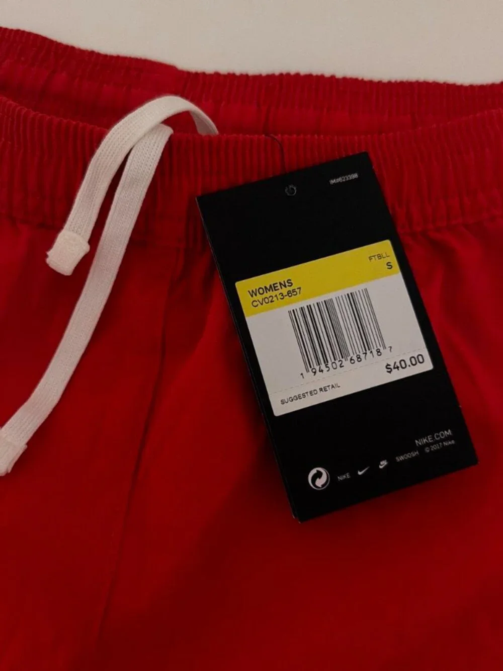 Nike red shorts with white side panels